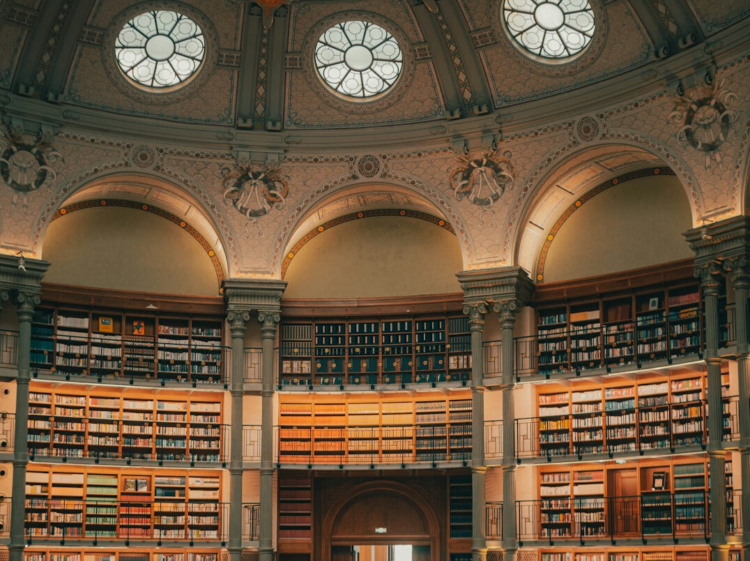 Interior of an old library with tall wooden shelves
