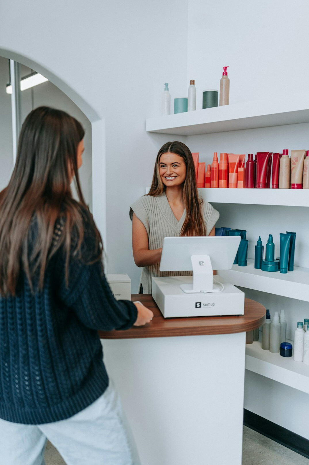 retail employee at cash register