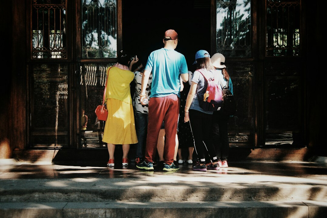 Group of four diverse professional writers standing together