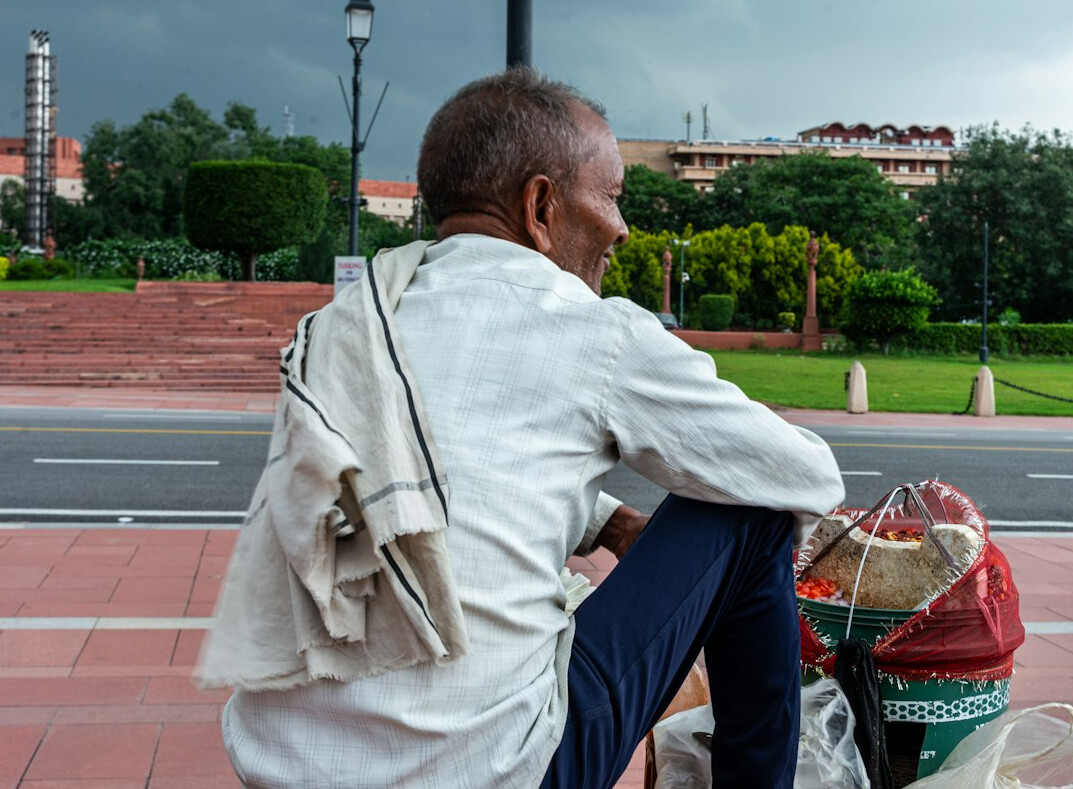 man hiding items in bag